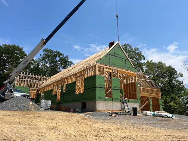 Sharpline constructing a house.