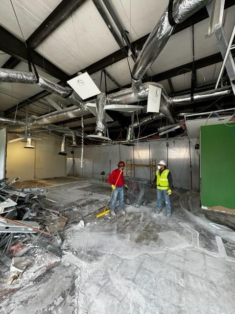 Sharpline workers cleaning a work site.